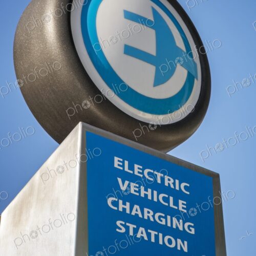 Close-up of an electric vehicle charging station sign with plug icon, photographed… Close-up of an electric vehicle charging station sign with plug icon, photographed…
