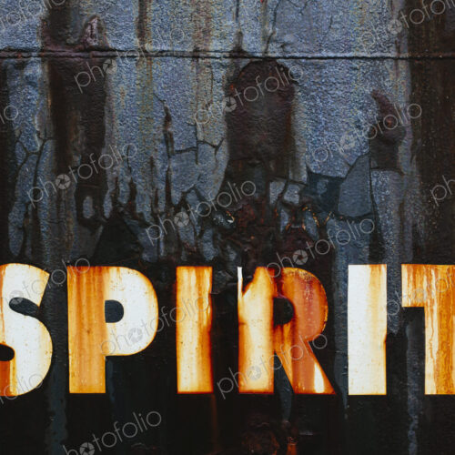 Close up of an old, rusty, commercial fishing boat. The word Spirit painted on the hull. Close up of an old, rusty, commercial fishing boat. The word Spirit painted on the hull.