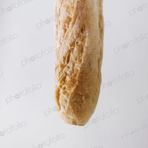 Close up of an organic baked sourdough baguette. Close up of an organic baked sourdough baguette.