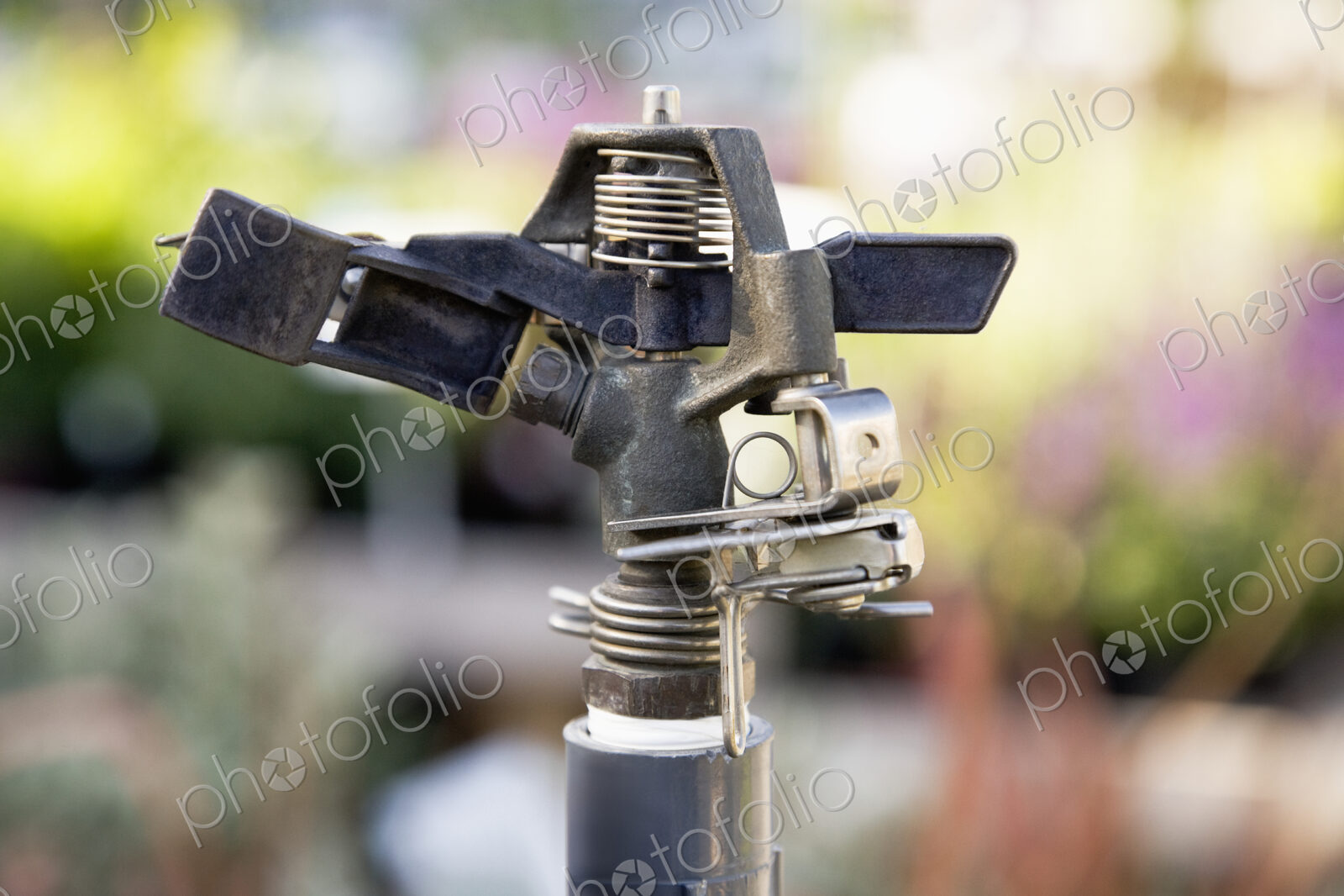 Close up of automated watering spray nozzle.