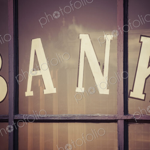 Close up of "bank" written on window panes Close up of "bank" written on window panes