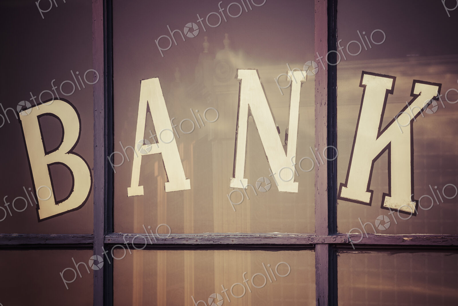 Close up of “bank” written on window panes