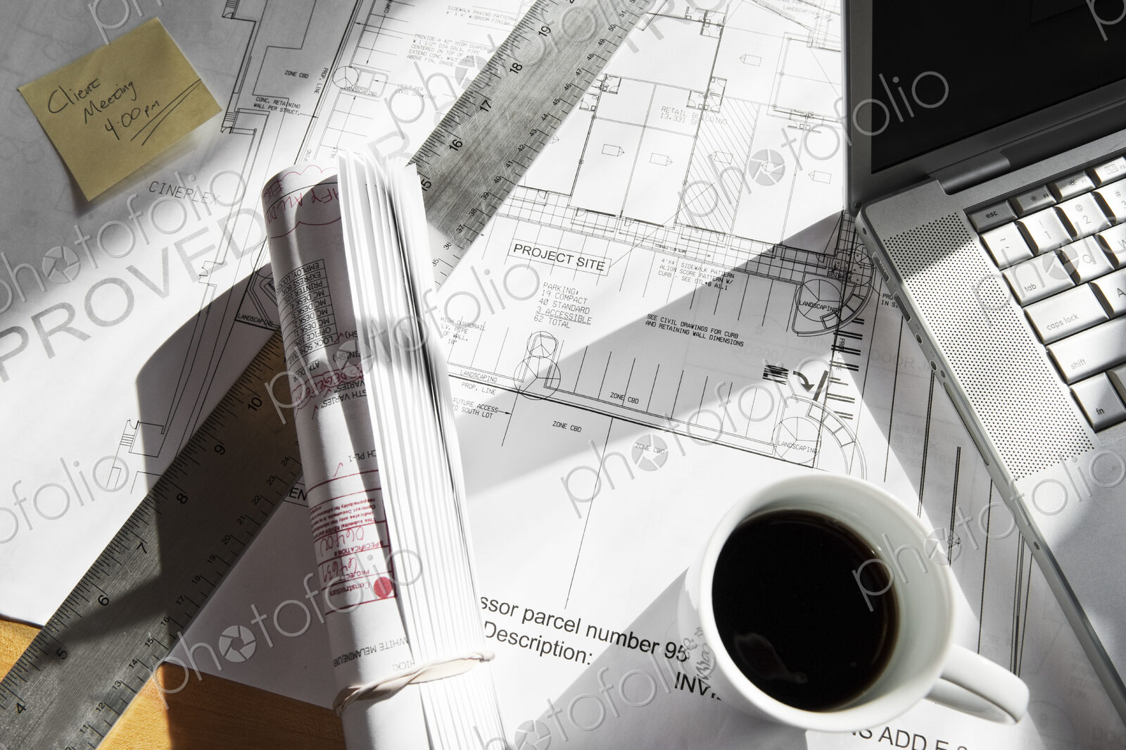 Close-up of blueprints on a desk top in a creative office.