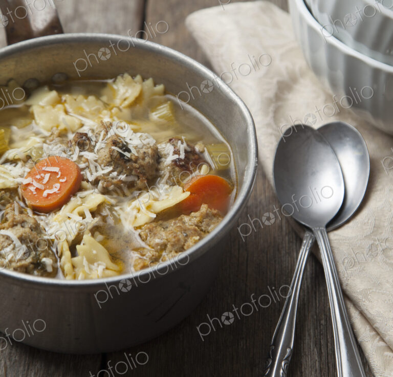 Close up of bowl of soup with spoons