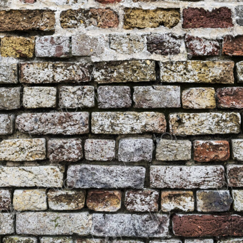 Close up of brick wall with bricks in a variety of colours and textures. Close up of brick wall with bricks in a variety of colours and textures.