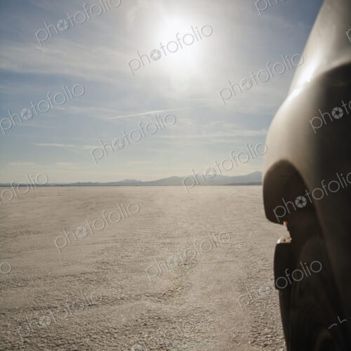 Close up of car driving on salt flats, Bonnaville Salt Flats, Utah, United States