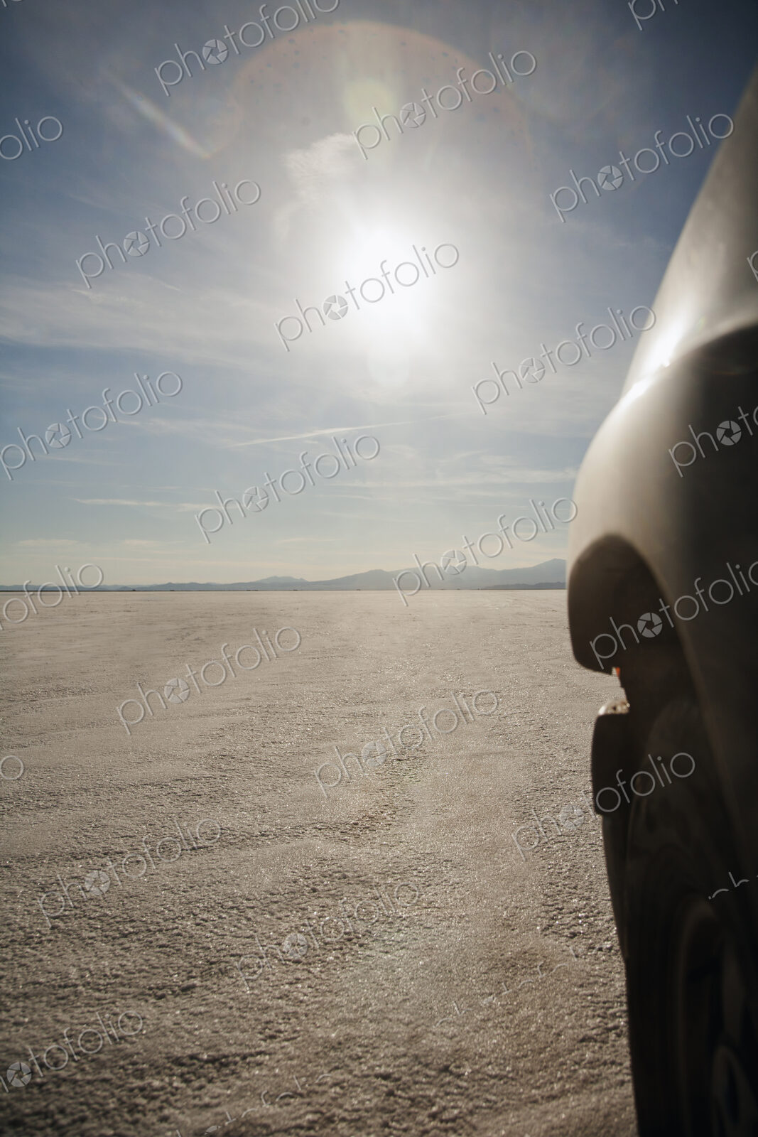 Close up of car driving on salt flats, Bonnaville Salt Flats, Utah, United States