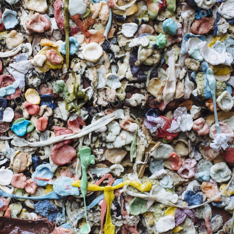 Close up of chewed bubble gum stuck on The Gum Wall in Pike Place market in Seattle.