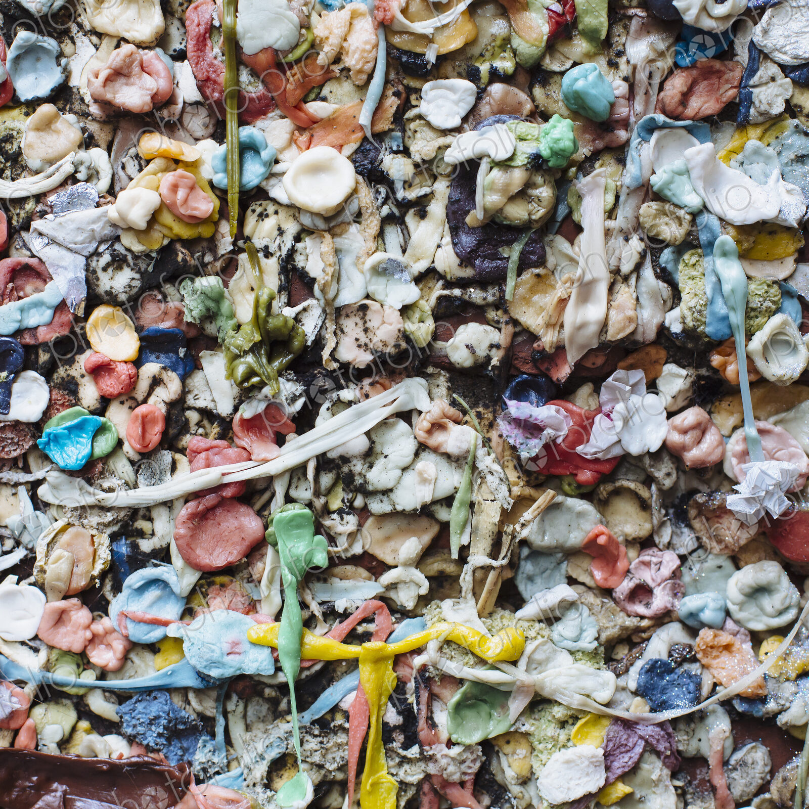 Close up of chewed bubble gum stuck on The Gum Wall in Pike Place market in Seattle.