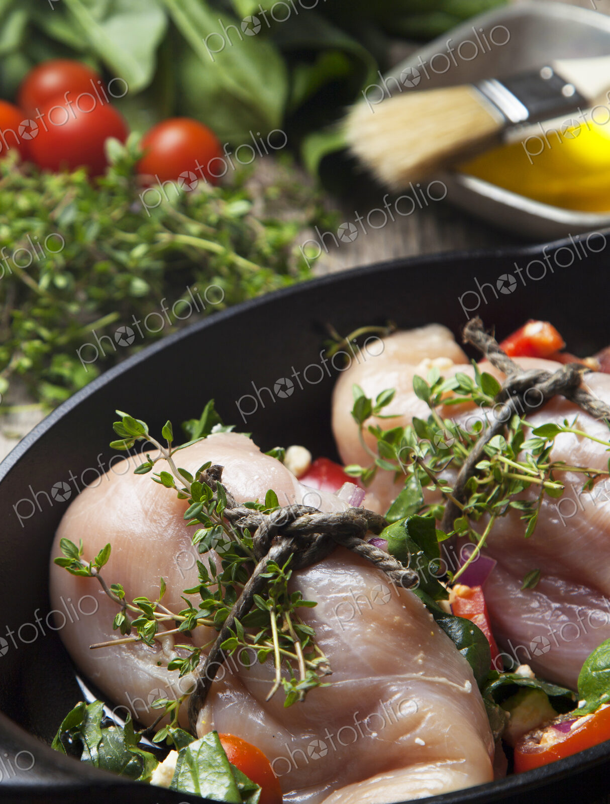Close up of chicken breast wrapped with herbs