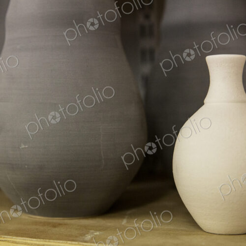 Close up of clay pots in the drying process, pre-firing. Hand thrown pottery. Close up of clay pots in the drying process, pre-firing. Hand thrown pottery.