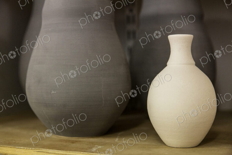 Close up of clay pots in the drying process, pre-firing. Hand thrown pottery.