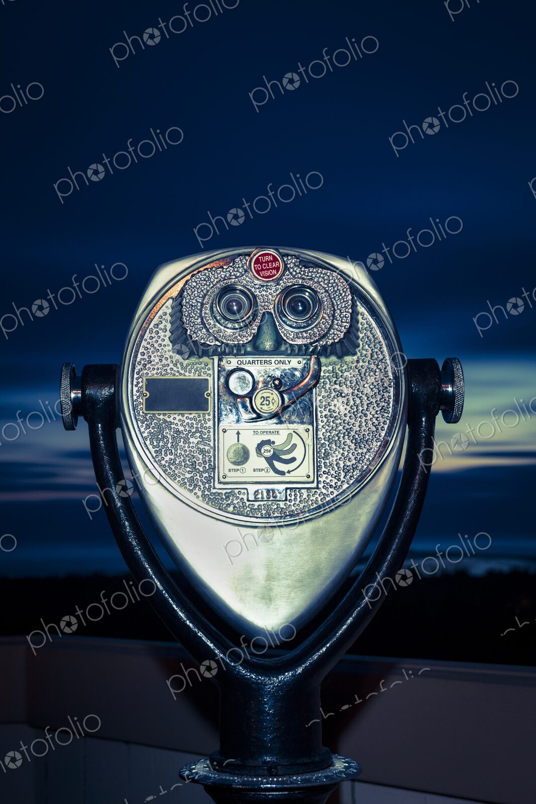 Close-up of coin-operated binoculars at dusk, overlooking Winchester Bay, Oregon.