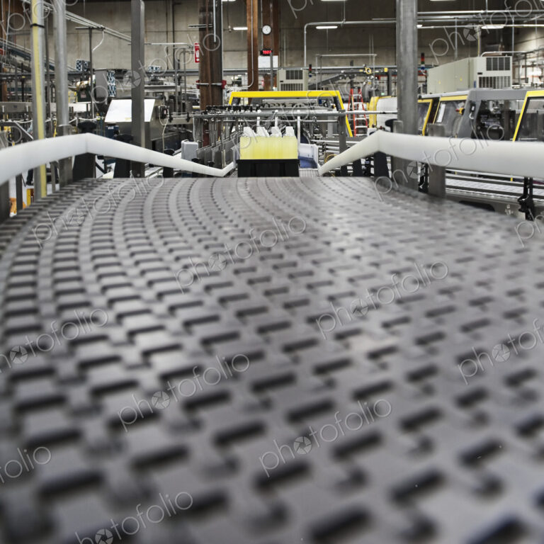 Close up of conveyor belt in bottling plant