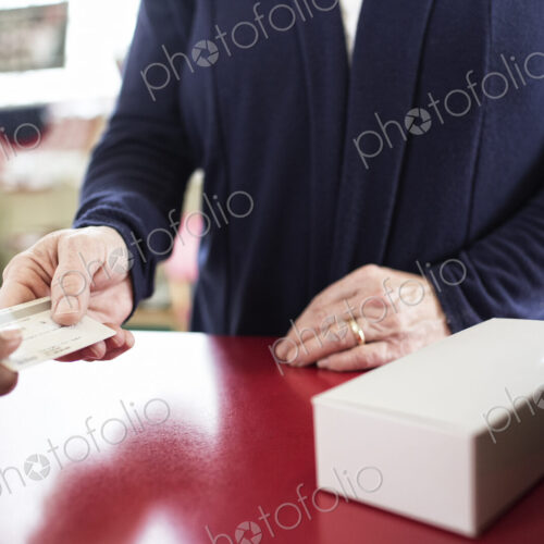Close up of credit card transaction taking place at a cash register. Close up of credit card transaction taking place at a cash register.