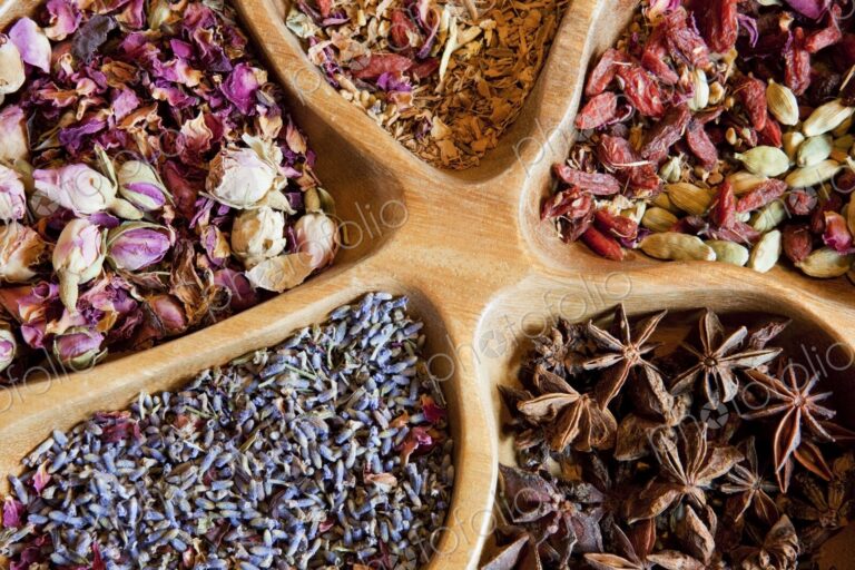 Close-up of dish with dried flowers, nuts and seeds in an apothecary shop