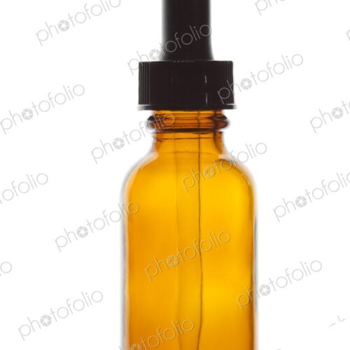 Close-up of dropper bottle, often used to dispense alternative medicine (homeopathy)… Close-up of dropper bottle, often used to dispense alternative medicine (homeopathy)…