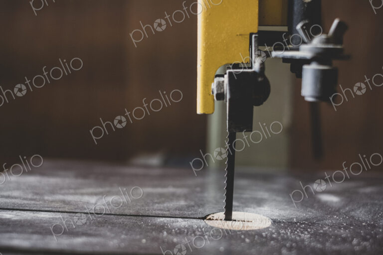 Close up of electric table saw in wood workshop.