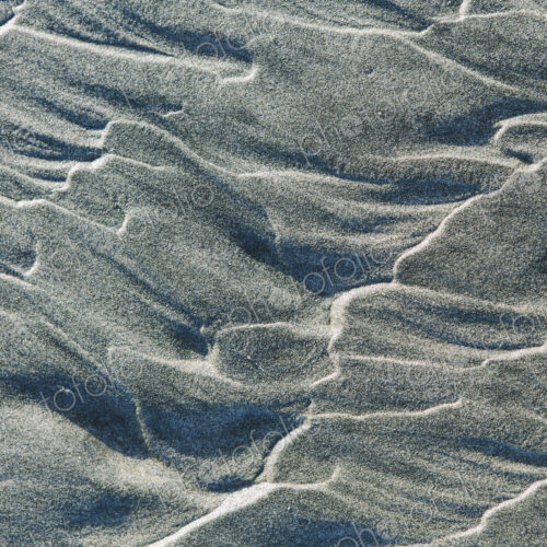 Close up of erosional sand patterns on beach