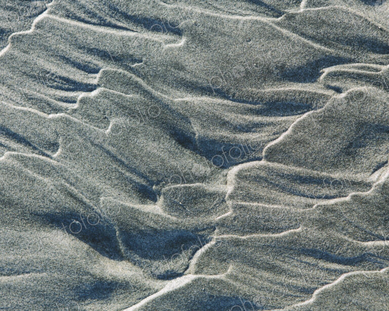 Close up of erosional sand patterns on beach