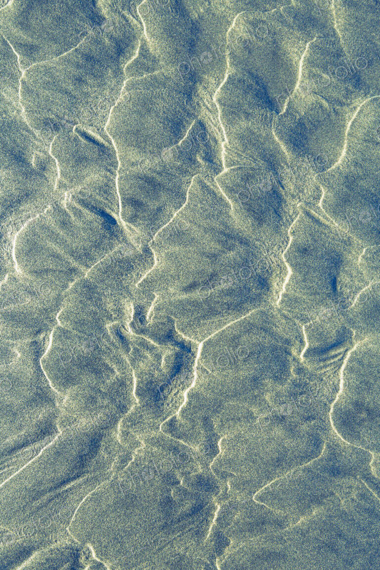 Close up of erosional sand patterns on beach, wavy patterns