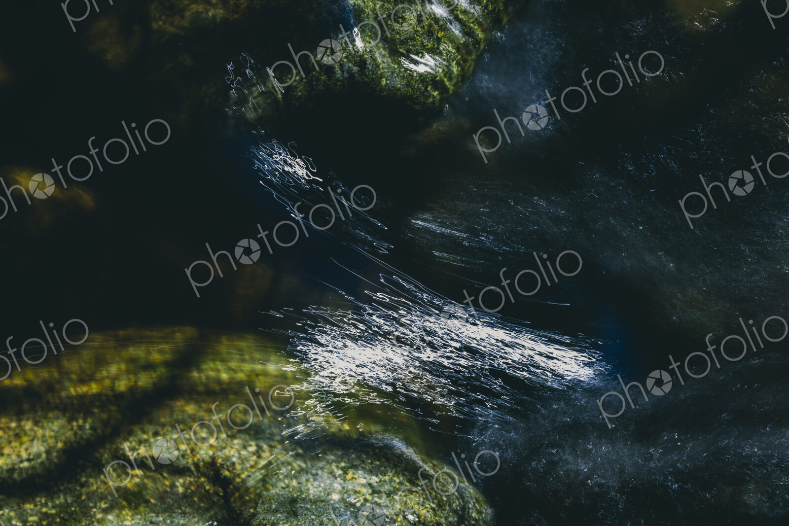 Close up of fast flowing river water, North Fork Snoqualmie River, near North Bend,…