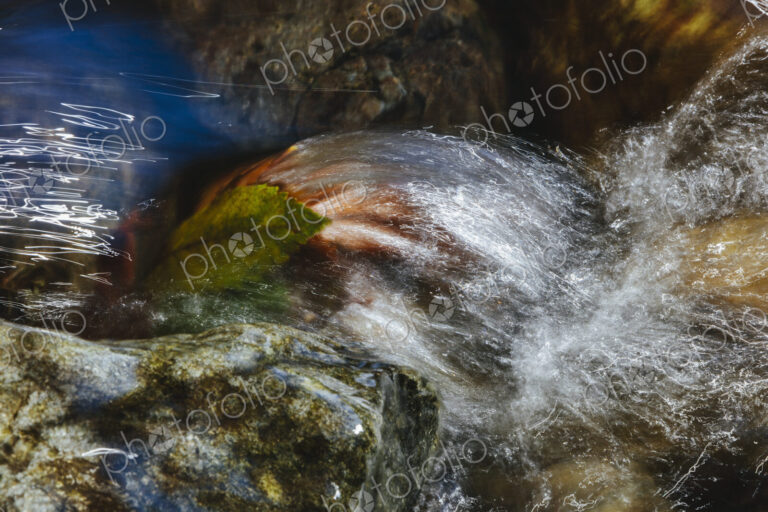Close up of fast flowing river water, North Fork Snoqualmie River, near North Bend,…