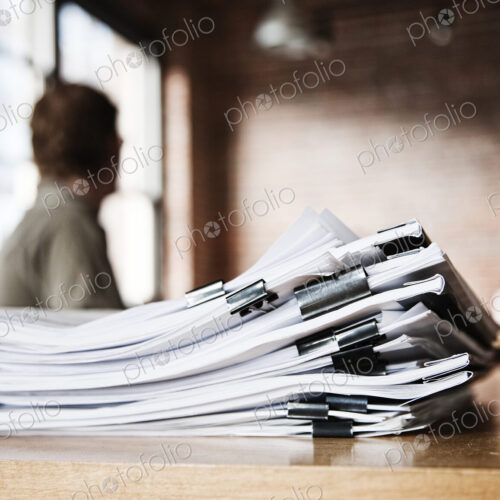 Close-up of files and file folders on a desk top in an office. Close-up of files and file folders on a desk top in an office.