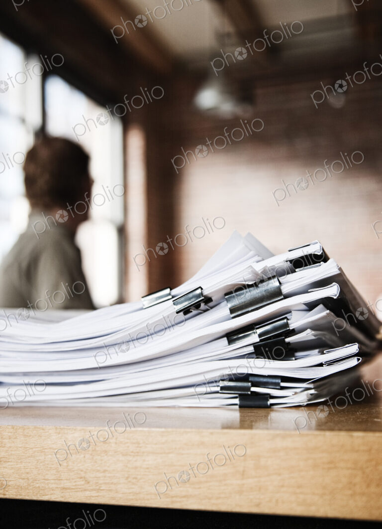 Close-up of files and file folders on a desk top in an office.