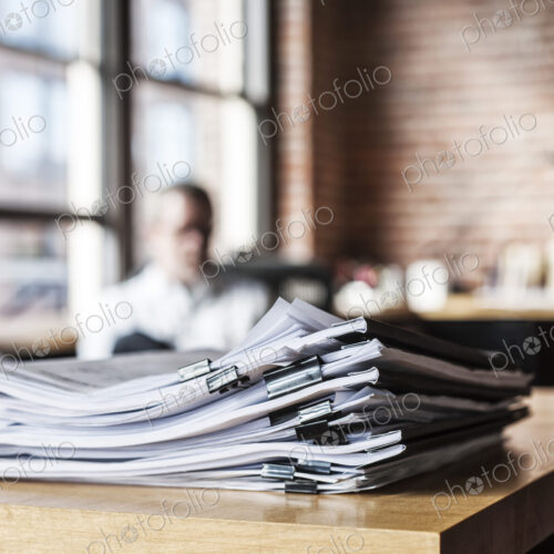 Close-up of files and file folders on a desk top in an office.