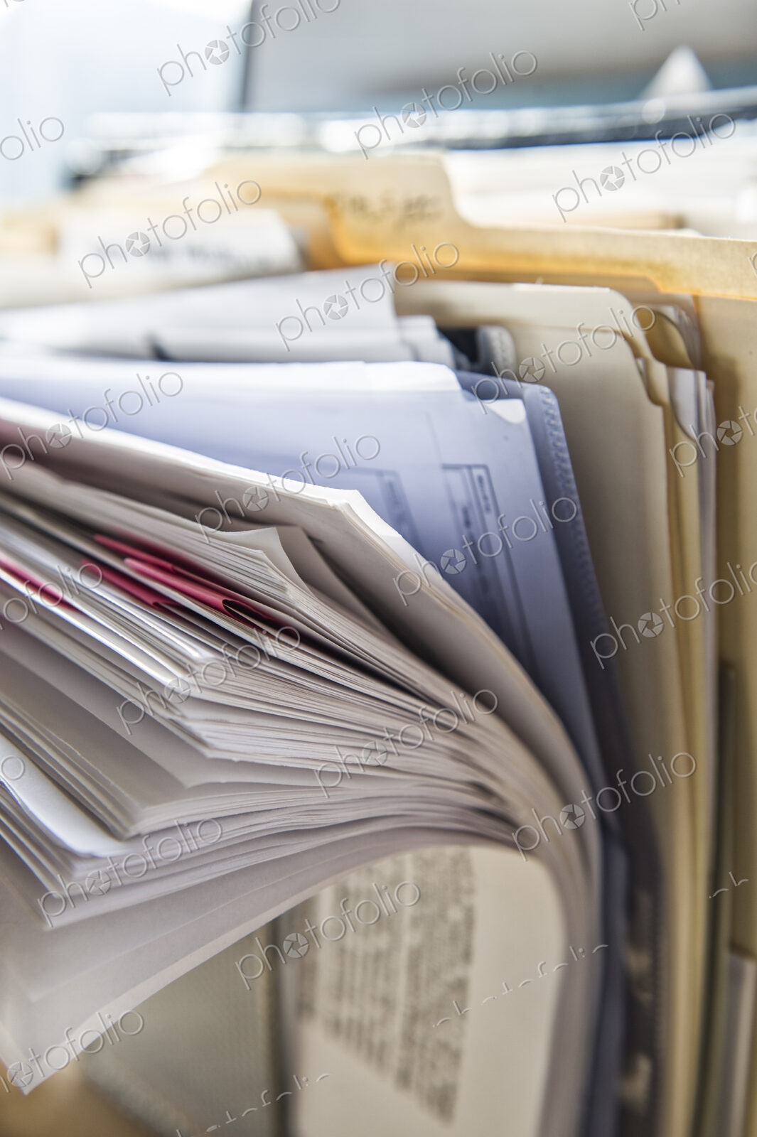 Close-up of files and file folders on a desk top in an office.
