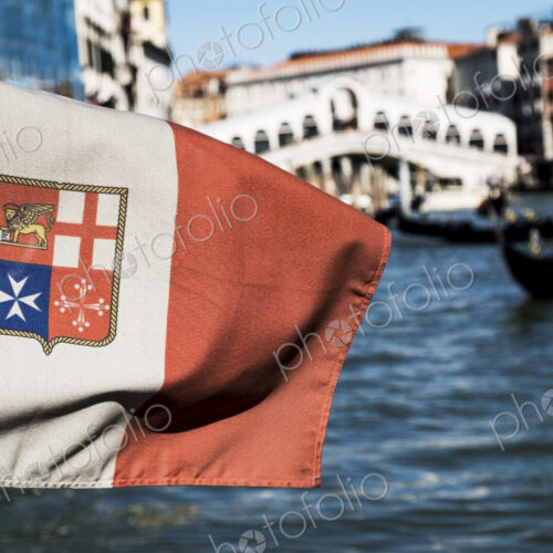 Close up of flag on a gondola on a canal in Venice, Veneto, Italy.