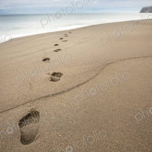 Close up of footprints in beach sand Close up of footprints in beach sand