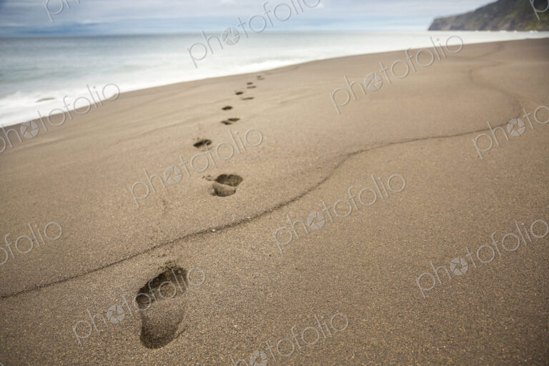 Close up of footprints in beach sand