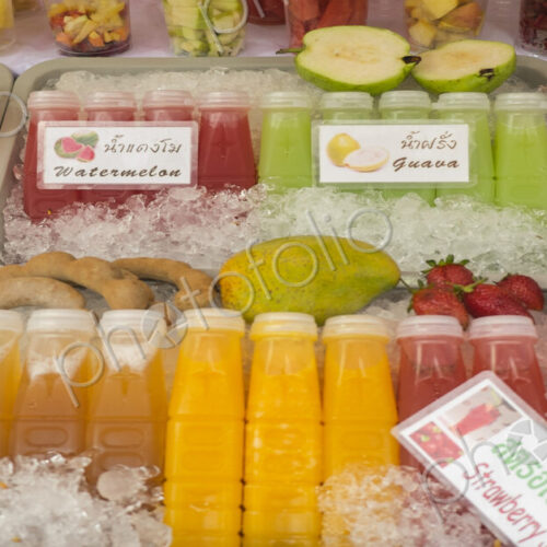 Close up of fresh juices for sale in market