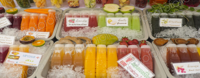 Close up of fresh juices for sale in market