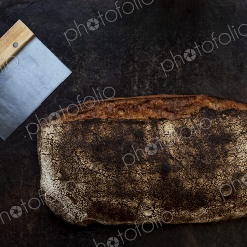 Close up of freshly baked loaf of bread in an artisan bakery.