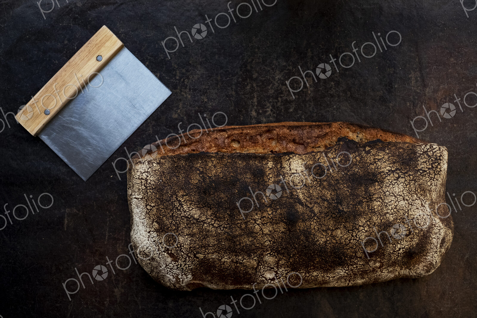 Close up of freshly baked loaf of bread in an artisan bakery.