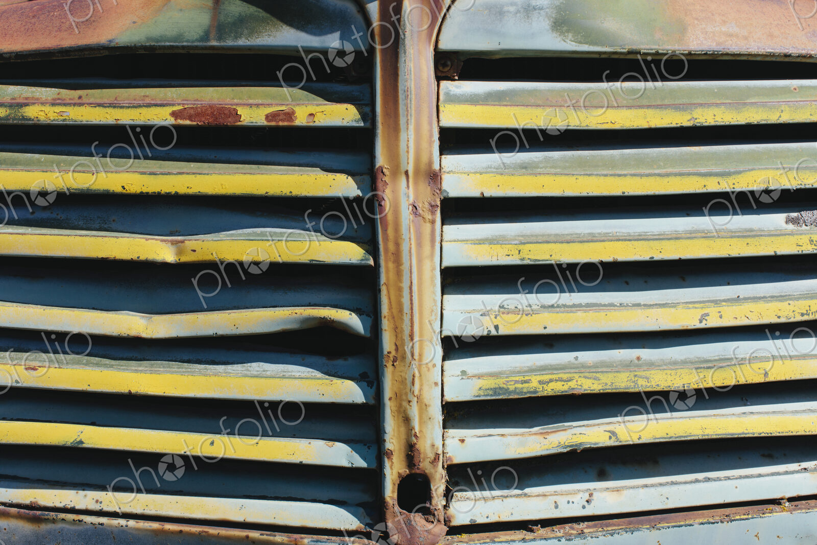 Close up of front grille from abandoned antique truck