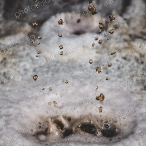 Close up of grape juice in a vat in a winery. Close up of grape juice in a vat in a winery.