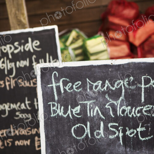 Close up of handwritten blackboard at farm shop advertising free range pork and beef. Close up of handwritten blackboard at farm shop advertising free range pork and beef.