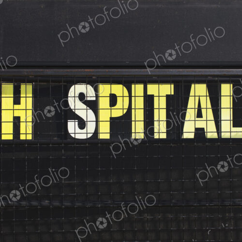 Close up of hospital sign with missing O Close up of hospital sign with missing O
