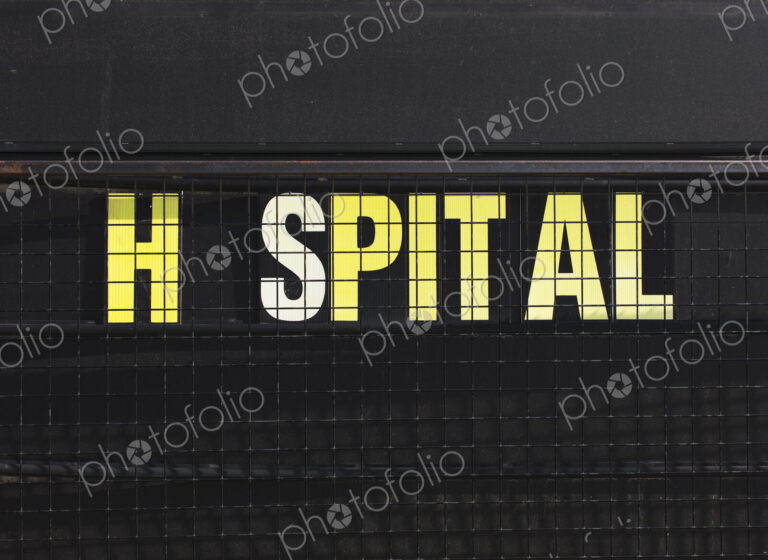 Close up of hospital sign with missing O