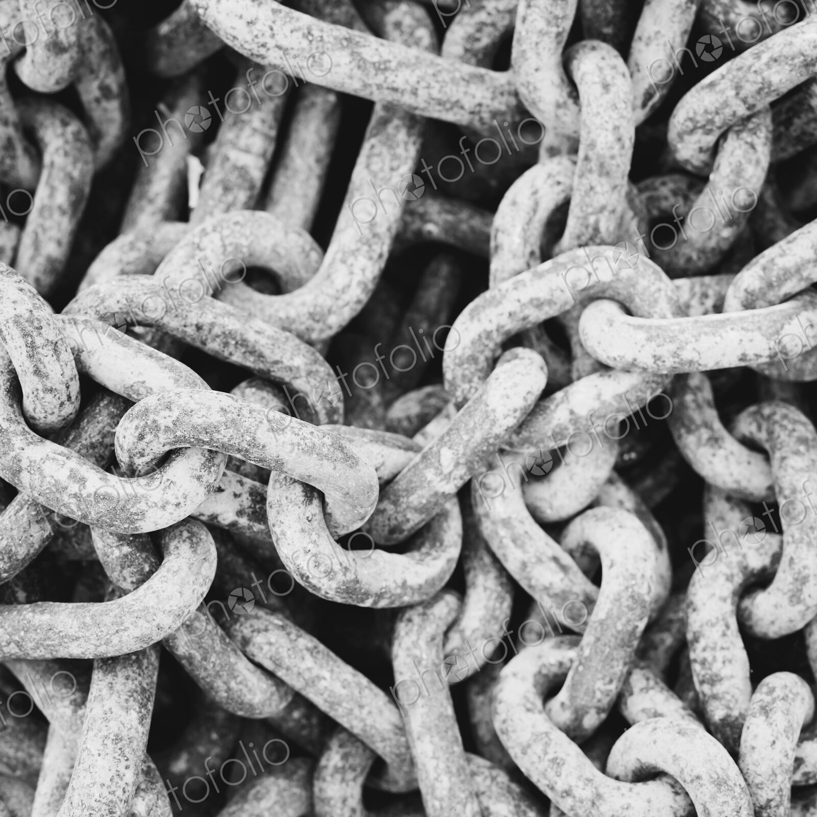 Close up of industrial chains in a heap.