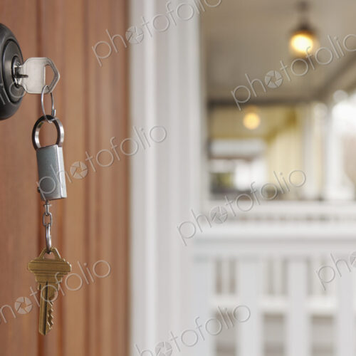 Close up of key in front door lock. Close up of key in front door lock.