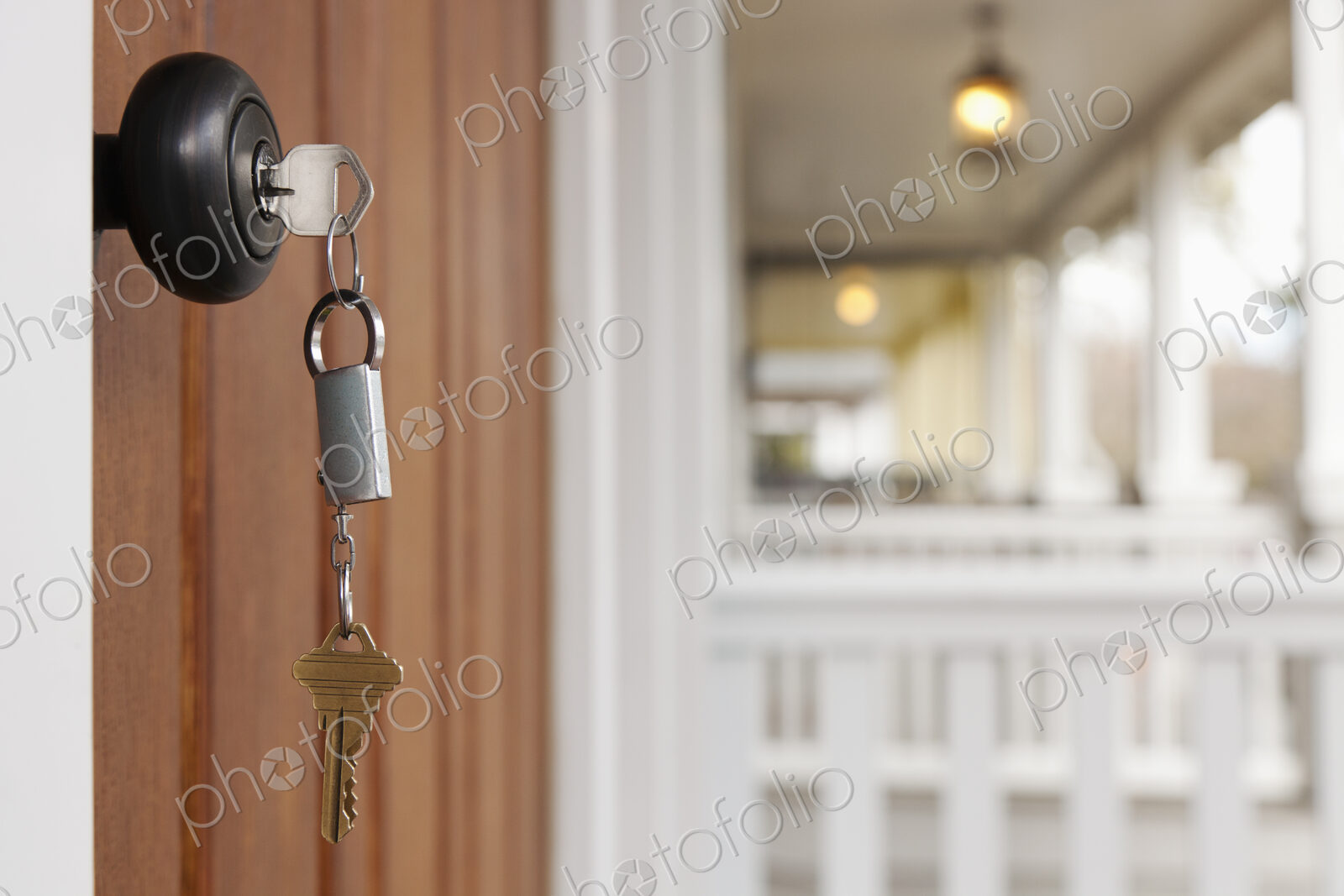 Close up of key in front door lock.