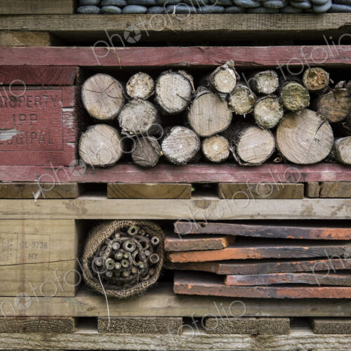 Close up of large bug house with several layers of different materials.