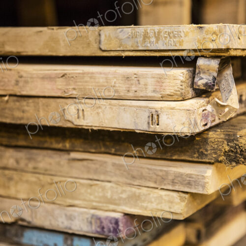 Close up of large selection of wooden planks stacked on shelves in a warehouse. Close up of large selection of wooden planks stacked on shelves in a warehouse.