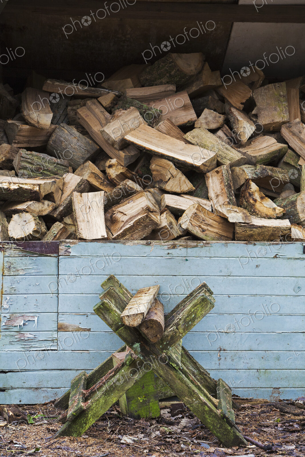 Close up of large stack of firewood at a farm.