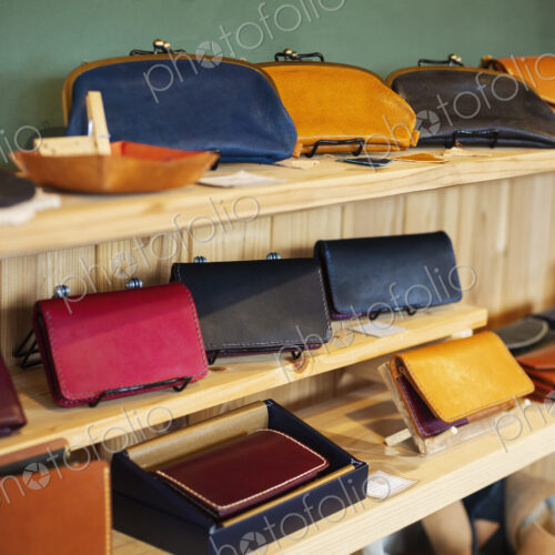 Close up of leather handbags on a shelf in a leather shop. Close up of leather handbags on a shelf in a leather shop.
